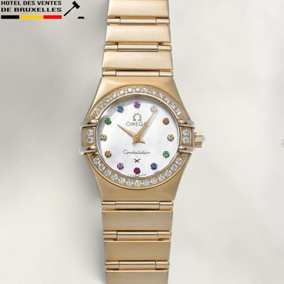 an image of a close up of a wrist watch with a diamond bezel