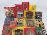 a lot of small toy houses and buildings in the box