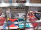 many books in the cage on the table