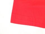 the red napkin is on the table ready to be used