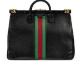 a black leather handbag with a green, red and green stripe