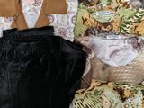 several pieces of clothing are laid out on a white surface