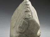 an image of a rock with a carving of a man on it