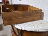a wooden box with a marble top sitting on top of a table