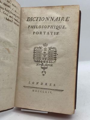 an open book with a picture of a coat of arms on it