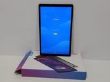 the tablet is sitting on top of a box on the table