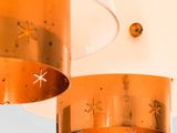 two lamps hanging from the ceiling in a room