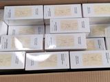 many boxes of soaps in a box on a table