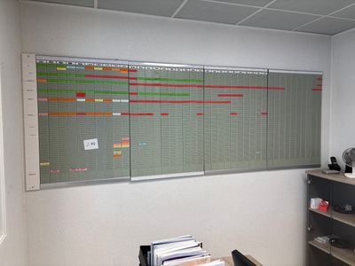 an image of an office with a large calendar on the wall