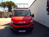 a red truck parked in front of a building