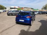 a blue car that is parked in a parking lot