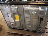 a large metal box that has a lot of wires on top of it