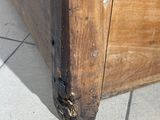 a close up of a wooden door with peeling paint