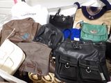 a lot of purses that are sitting in a bag