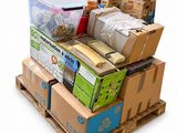 a pile of boxes and containers on a pallet