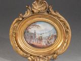 an ornate gold frame with a painting of a scene in a park