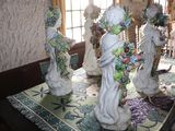 three statues on the table in the dining room