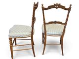 pair of antique wooden chairs with upholstered seat and back cushions