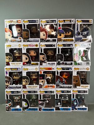 a lot of pop vinyl figures on display on the table
