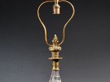 an antique brass and glass table lamp with a glass shade