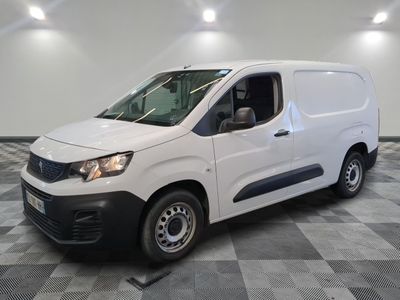 the white van is parked on a checkered tile floor