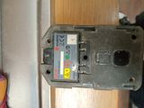 a close up of a broken electrical device on a door