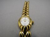 an image of a close up of a wrist watch on a table