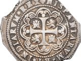 an old silver coin with a cross on it