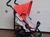 a baby stroller sitting in front of a garage door