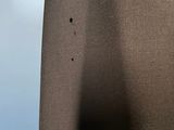 a close up of a person ' s leg with a hole in it