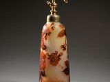 an image of a glass bottle with flowers on it