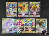Des cartes Pokémon sont alignées en rangée sur une table