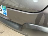 a close up of a car ' s license plate on the back of it