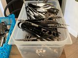 many spoons and spoon spoons in a plastic container on a table