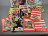 a lot of comic books sitting on a table