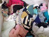 a pile of clothes that is in a white box