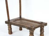 a small wooden bench with a wooden seat on it