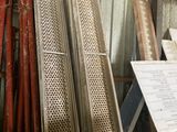 several pieces of metal are stacked on top of each other in a room