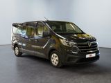 the black van is parked in a room with a white wall