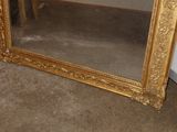 a mirror that is sitting on the floor in the room