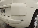 a white car that is parked in a garage
