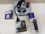 a picture of a desk top with a charger and a box of batteries