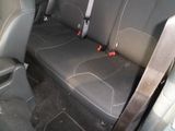 two seats in the back of a car that are black