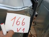 a man holding a sign that says 1564 on it