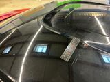 a remote control attached to the windshield of a car
