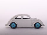 a white toy car with blue wheels on a white surface