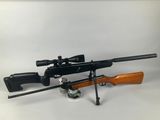 a rifle and a rifle on a white background