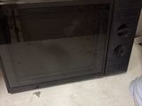 a microwave oven sitting on a counter in a kitchen