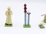 four figurines of different types of people and animals
