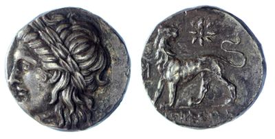 a silver coin with an image of a woman and a lion on it